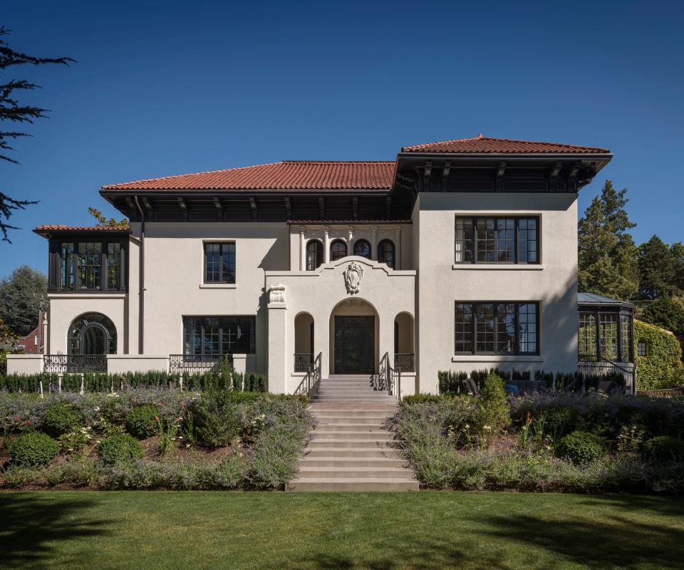 exterior of whitewashed house with blue sky