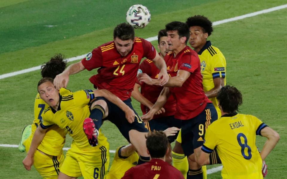 Players vie for the header during the UEFA EURO 2020 Group E football match between Spain and Sweden at La Cartuja Stadium in Sevilla  - AFP