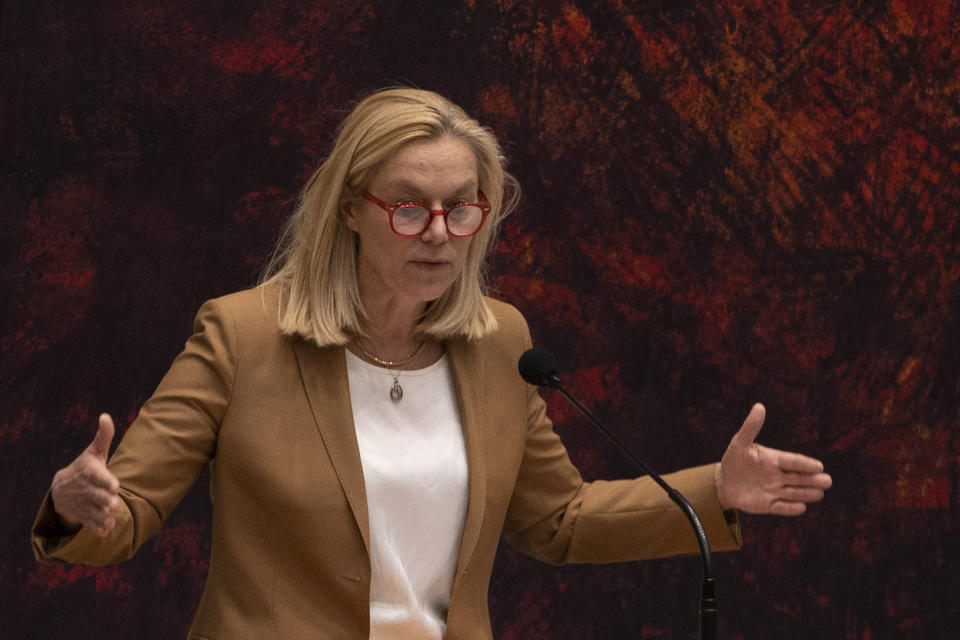 Sigrid Kaag, leader of the centrist D66 party that finished second in elections last month, right, gestures during a debate in parliament in The Hague, Netherlands, early Friday, April 2, 2021. Caretaker Dutch Prime Minister Mark Rutte was fighting for his political life in a bitter parliamentary debate about the country's derailed process of forming a new ruling coalition following elections last month. (AP Photo/Peter Dejong)