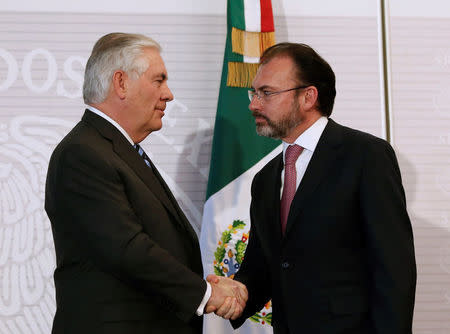U.S. Secretary of State Rex Tillerson (L) and Mexico's Foreign Minister Luis Videgaray shake hands after a joint news conference at the foreign ministry in Mexico City, Mexico February 23, 2017. REUTERS/Carlos Jasso