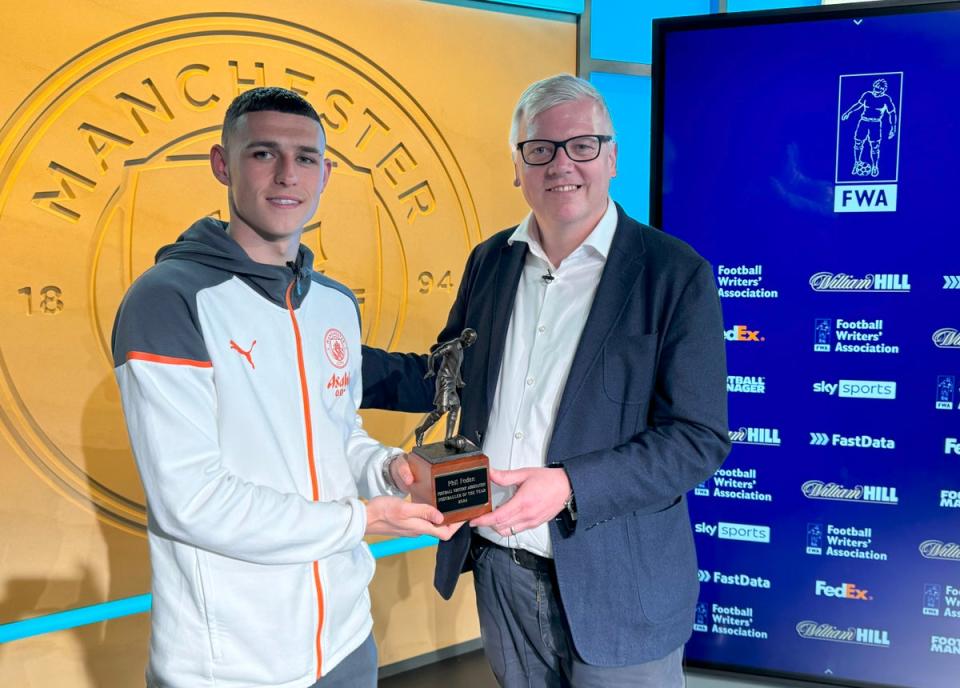 Phil Foden was presented his trophy by FWA Chair John Cross. (FWA Handout Photo/PA Wire)