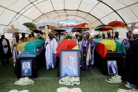 The coffins of Amhara president Mekonnen and two other officials are seen during a funeral ceremony in the town of Bahir Dar
