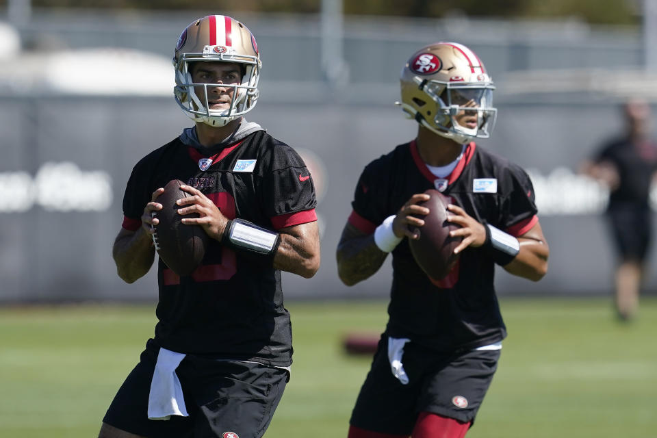 San Francisco 49ers quarterbacks Jimmy Garoppolo, left, and Trey Lance take part in drills at the NFL football team's practice facility in Santa Clara, Calif., Thursday, Sept. 1, 2022. (AP Photo/Jeff Chiu)