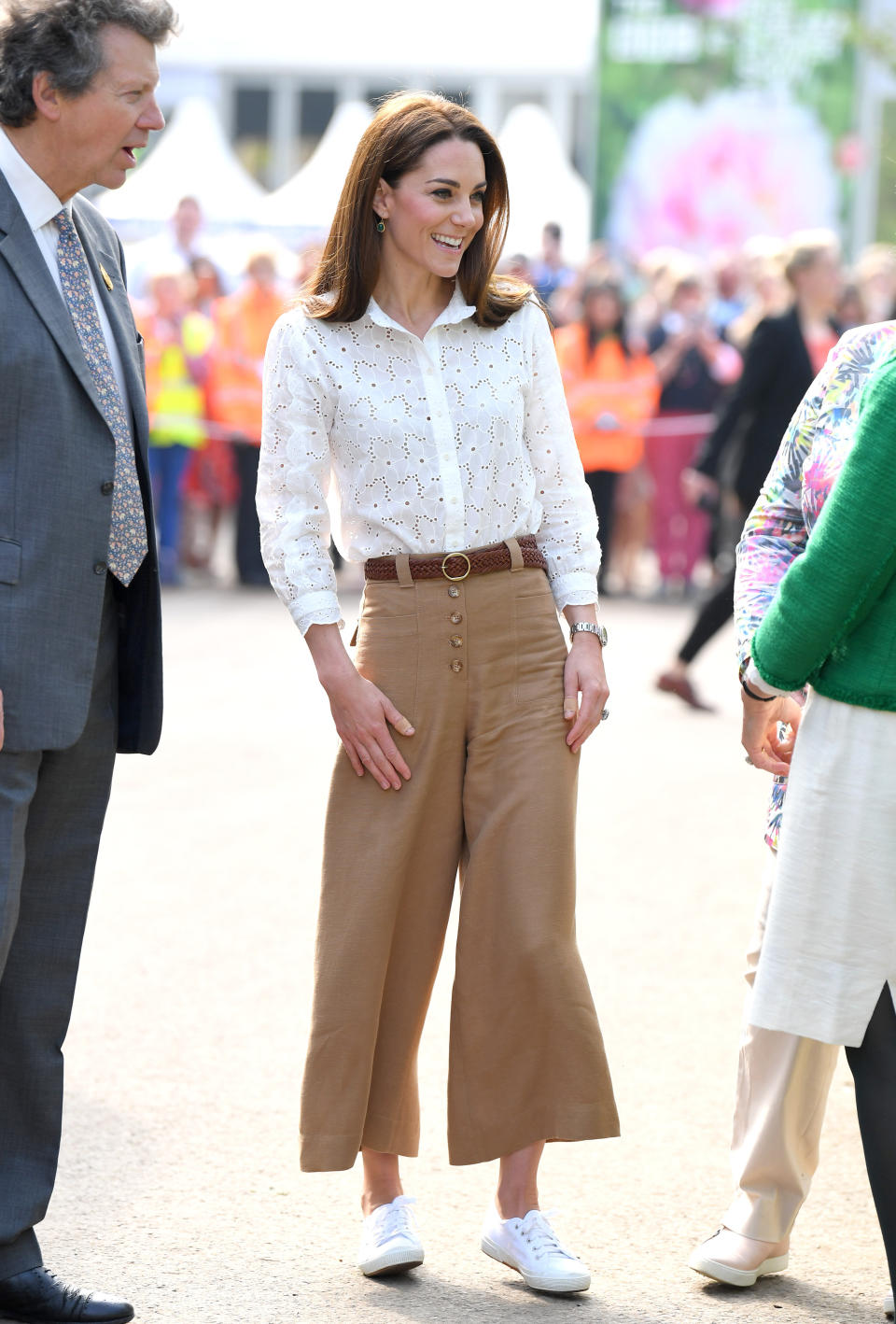 The Duchess of Cambridge sports cropped pants and a lightweight blouse with her Superga sneakers. (Photo: Getty Images)