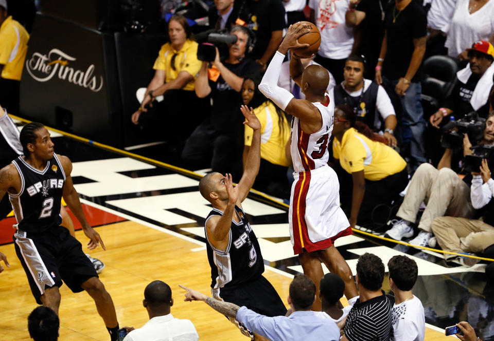 MIAMI, FL - JUNE 18:  Ray Allen #34 of the Miami Heat makes a game-tying three-pointer over Tony Parker #9 of the San Antonio Spurs in the fourth quarter during Game Six of the 2013 NBA Finals at AmericanAirlines Arena on June 18, 2013 in Miami, Florida. NOTE TO USER: User expressly acknowledges and agrees that, by downloading and or using this photograph, User is consenting to the terms and conditions of the Getty Images License Agreement.  (Photo by Kevin C. Cox/Getty Images)