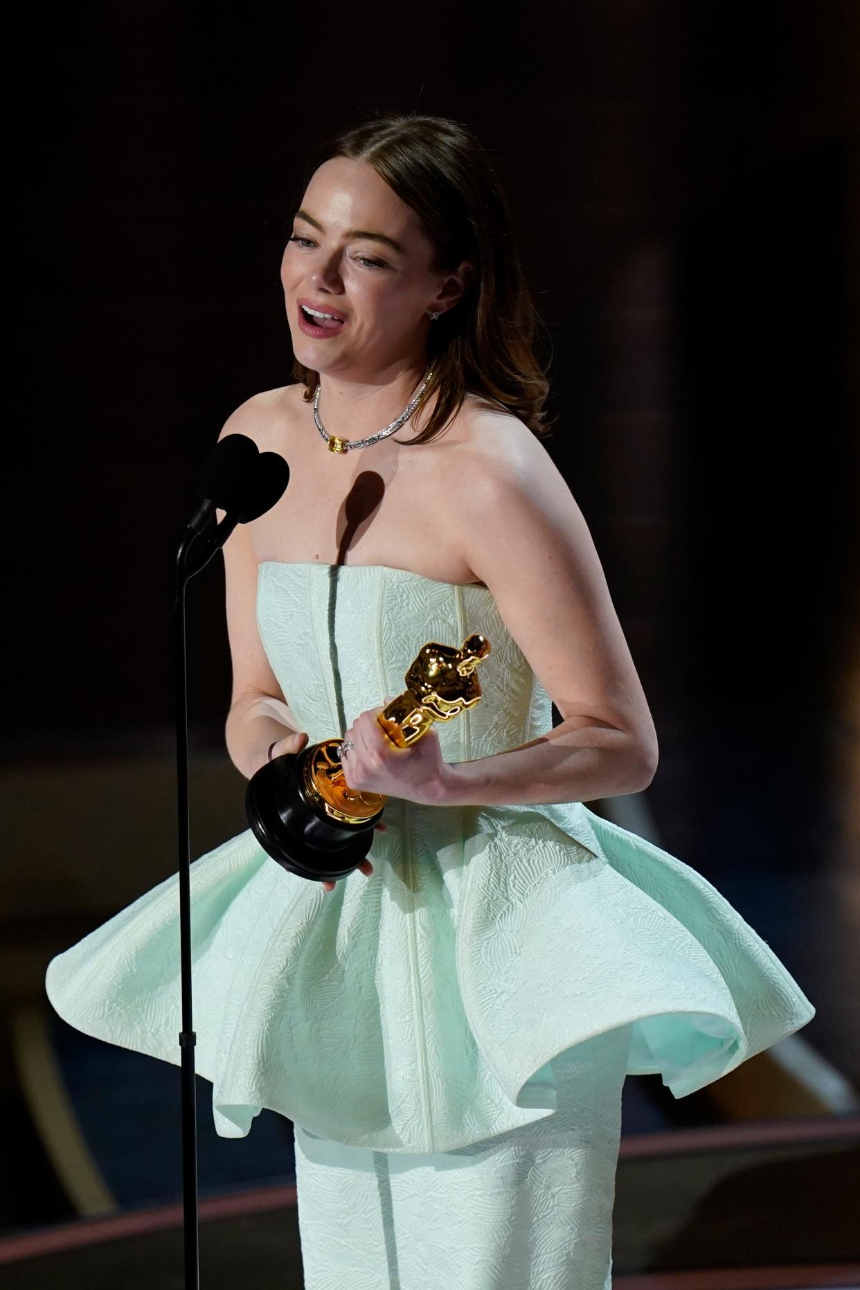 Emma Stone accepts the award for best actress in a leading role for her role in "Poor Things" during the 96th Oscars at the Dolby Theatre at Ovation Hollywood in Los Angeles on Sunday.