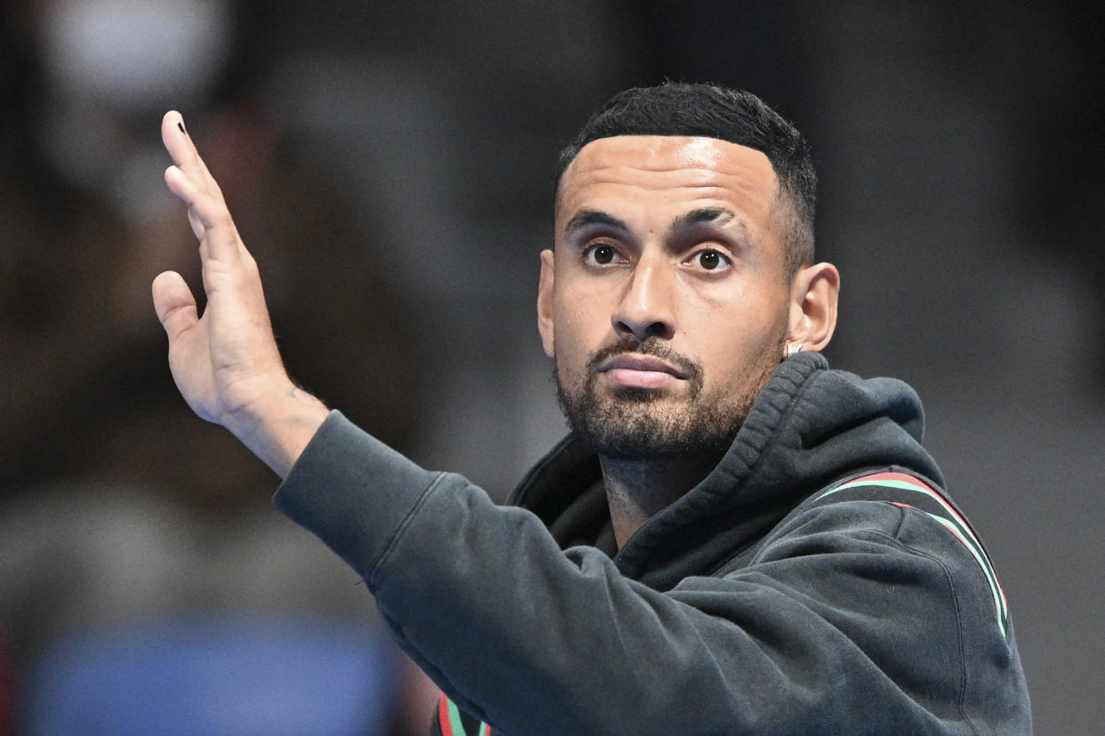 Nick Kyrgios of Australia announces his withdrawal due to a knee issue before his scheduled quarterfinal match with Taylor Fritz. (Photo by KAZUHIRO NOGI/AFP via Getty Images)