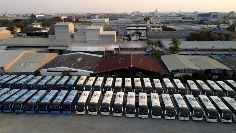 Buses that used to transport Chinese tourists around Thailand are seen idle due to travel bans and border closures from the global coronavirus disease (COVID-19) outbreak in a parking lot near Suvarnabhumi airport in Bangkok, Thailand