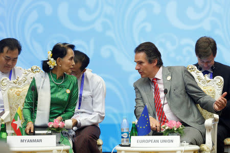 Myanmar State Counselor Aung San Suu Kyi (L) talks with Gunnar Wiegand (R), Managing Director for Asia and the Pacific at the European External Action Service, during the 13th Asia Europe Foreign Ministers Meeting (ASEM) in Naypyitaw, Myanmar, November 21, 2017. REUTERS/Stringer
