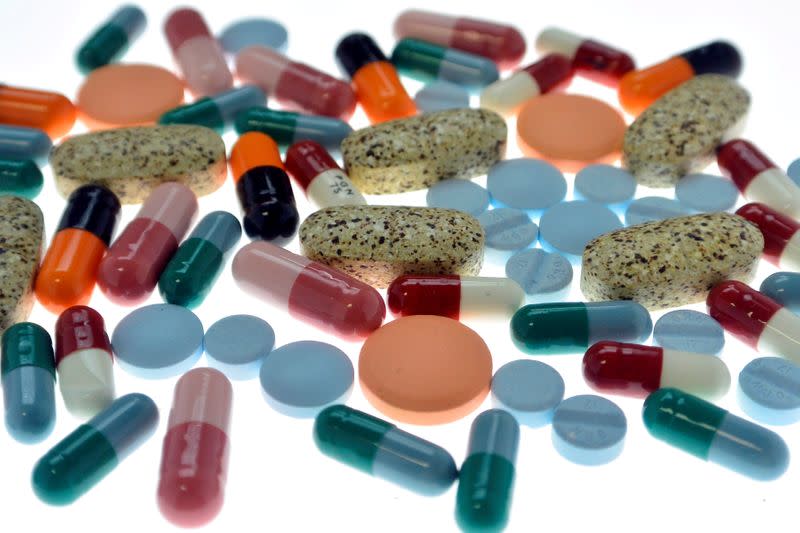 FILE PHOTO: Pharmaceutical tablets and capsules are arranged on table in photo illustration