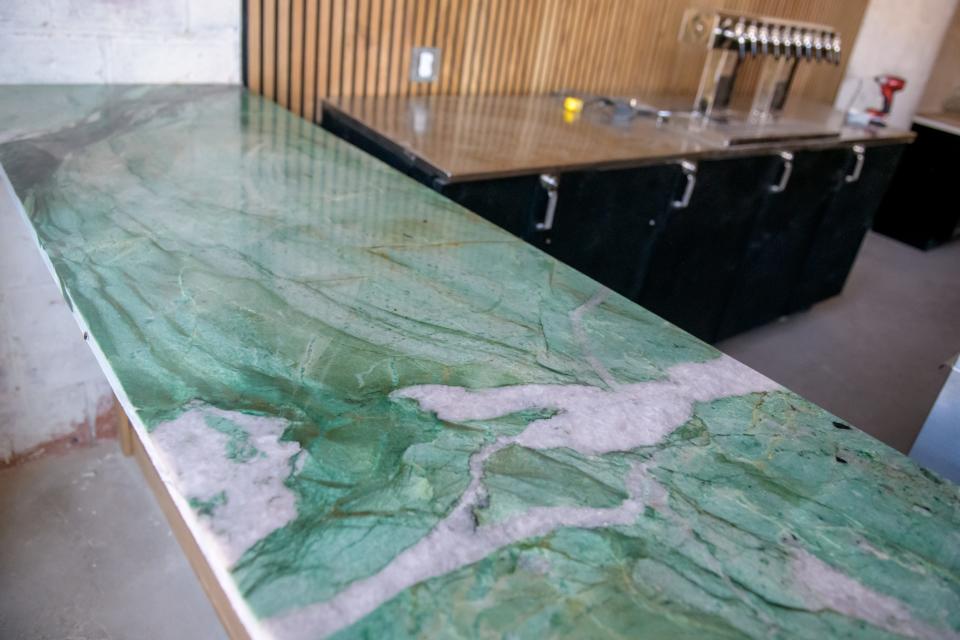 The custom-made bar at the new Pop-Up Chicken Shop in Peoria's Warehouse District features a unique granite top.