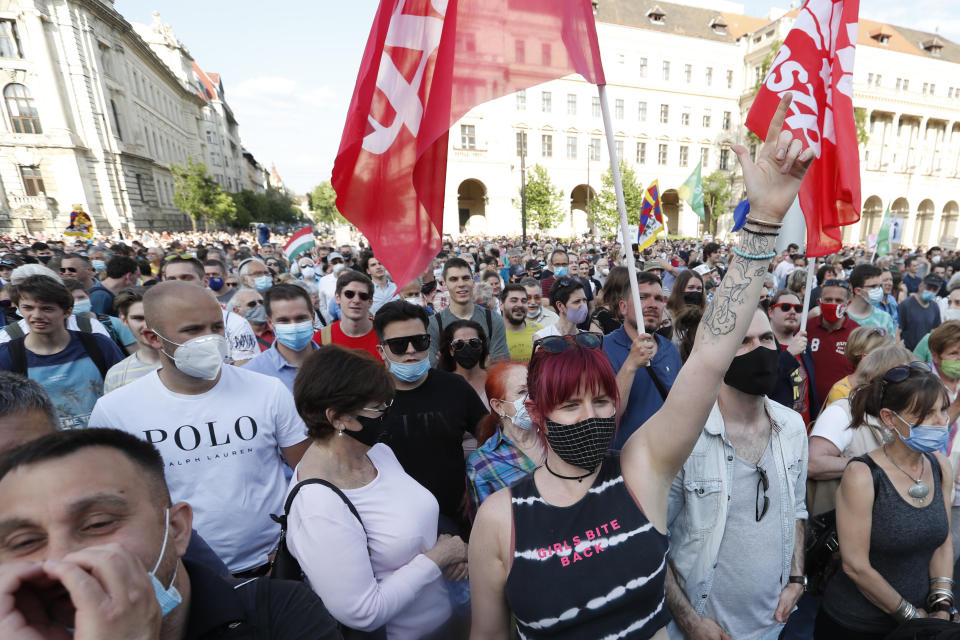 Protesters chant slogans as they rally in downtown Budapest, Hungary, Saturday, June 5, 2021. Thousands of people gathered opposing the Hungarian government's plan of building a campus for China's Fudan University in Budapest. (AP Photo/Laszlo Balogh)