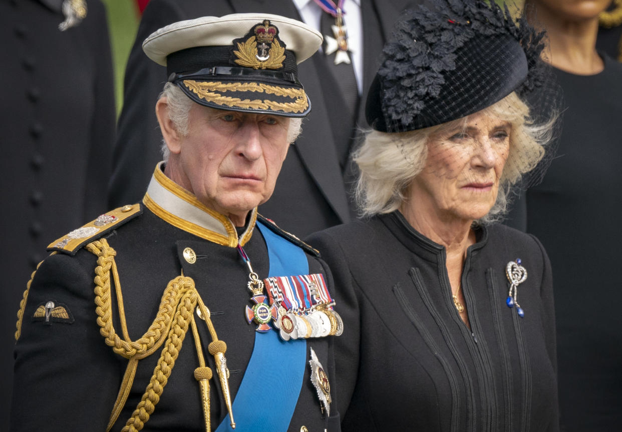 King Charles III and the Queen Consort look on as the State Gun Carriage carrying the coffin of Queen Elizabeth II arrives at Wellington Arch during the Ceremonial Procession following her State Funeral at Westminster Abbey, London.