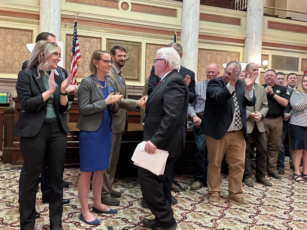 Sen. Mike Lang, R-Malta, shakes hands with Sen. Forrest Mandeville, R-Columbus, at a news conference on May 1 in which a bipartisan group of lawmakers and a coalition of supporters urged Gov. Greg Gianforte to sign Senate Bill 442.