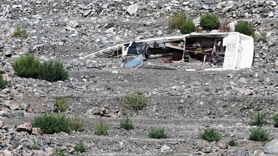 A boat buried in dry earth on Saddle Island.