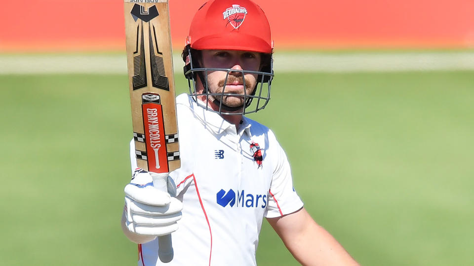 Travis Head, pictured here after scoring a century for South Australia against Queensland.