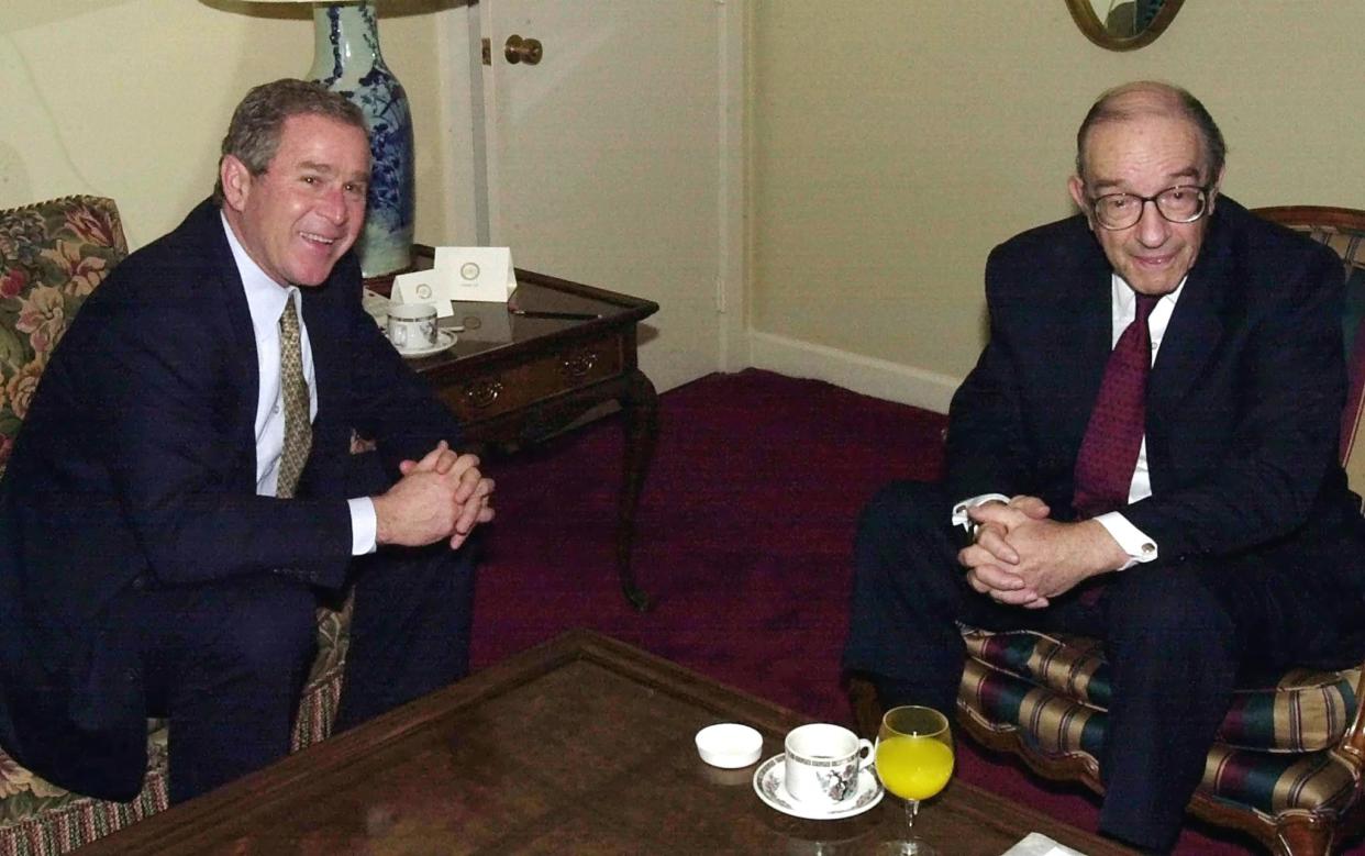 WASHINGTON, :  President-elect George W. Bush (L) meets with Federal Reserve Board Chairman Alan Greenspan at Bush's hotel in Washington, DC, 18 December 2000. Bush was making his first trip to the nation's capital since winning the election.    AFP PHOTO/Tannen MAURY (Photo credit should read TANNEN MAURY/AFP via Getty Images)