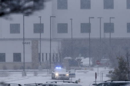 A police vehicle is seen left with the doors open at a Planned Parenthood center at 3480 Centennial Boulevard after reports of an active shooter in Colorado Springs, Colorado November 27, 2015. REUTERS/Isaiah J. Downing