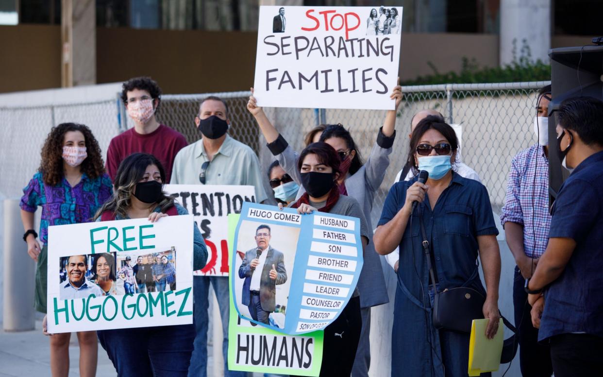 Activists and family members of detainees at the Adelanto Immigration Detention Center protest outside the Federal Building in Los Angeles - EUGENE GARCIA/EPA-EFE/Shutterstock