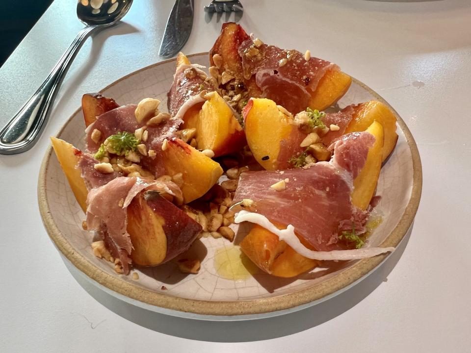 Peach, proscuitto di parma and hazelnut at Folk in East Nashville on Aug. 3, 2023