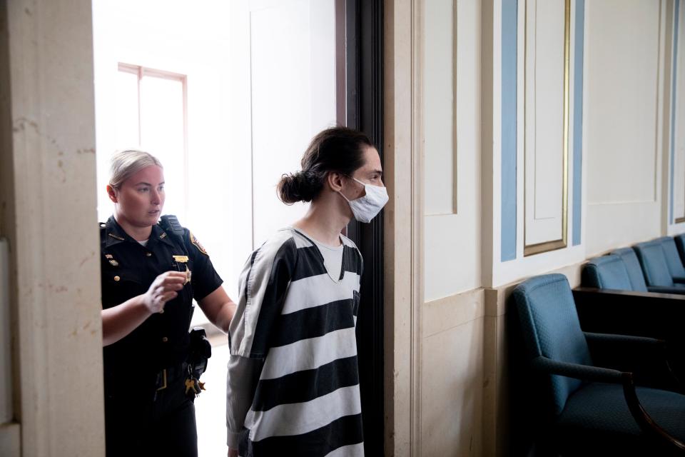 Jaret Wright is led into the courtroom before pleading guilty to charges of gross sexual imposition and possessing child pornography at the Hamilton County Courthouse in Cincinnati on Wednesday, May 25, 2022.