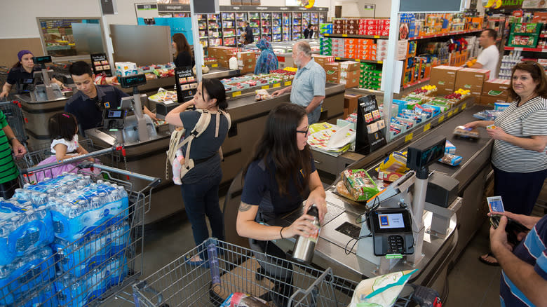 Aldi employees ringing up customers 