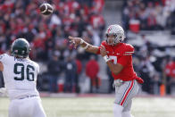 Ohio State quarterback C.J. Stroud throws a pass against Michigan State during the first half of an NCAA college football game Saturday, Nov. 20, 2021, in Columbus, Ohio. (AP Photo/Jay LaPrete)