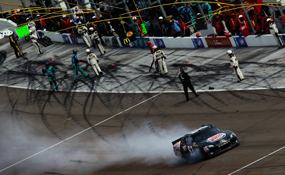 LAS VEGAS, NV - MARCH 11: Smoke flies from the #93 Burger King Toyota, driven by Travis Kvapil, after an incident in the NASCAR Sprint Cup Series Kobalt Tools 400 at Las Vegas Motor Speedway on March 11, 2012 in Las Vegas, Nevada. (Photo by Ronald Martinez/Getty Images for NASCAR)