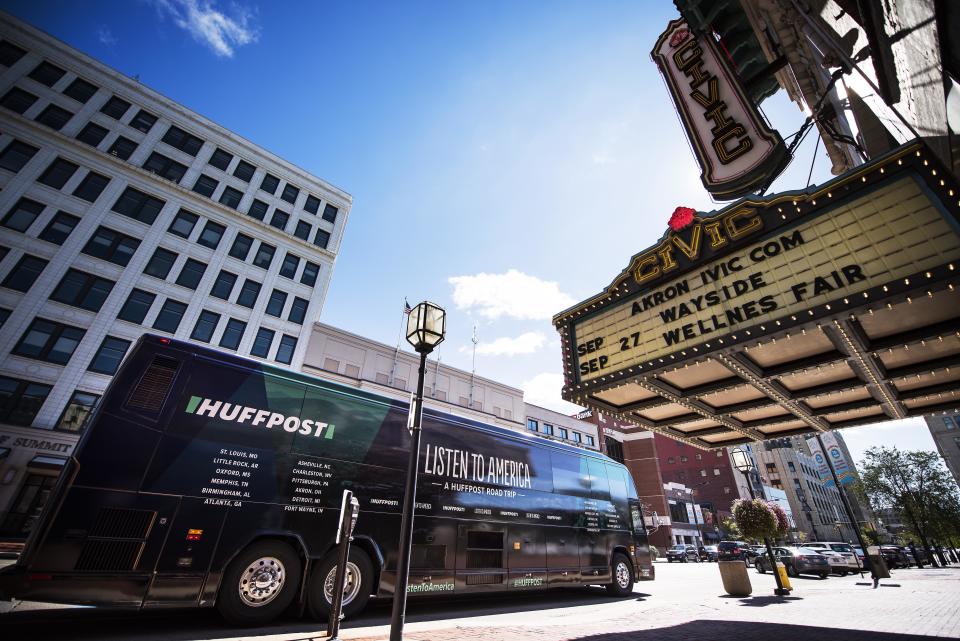 The HuffPost bus&nbsp;parks in front of the Akron Civic Theater in Ohio during "Listen To America: A HuffPost Road Trip." The news outlet will visit more than 20 cities on its tour across the country.