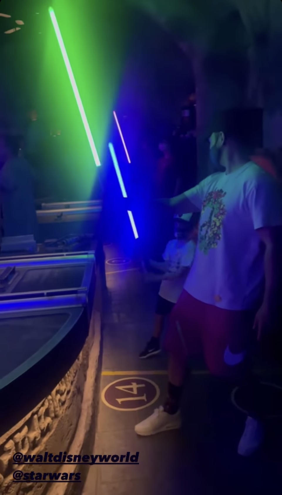 Justin Timberlake and his six year old son Silas trying out their newly assembled lightsabers at Disney World. (justintimberlake)