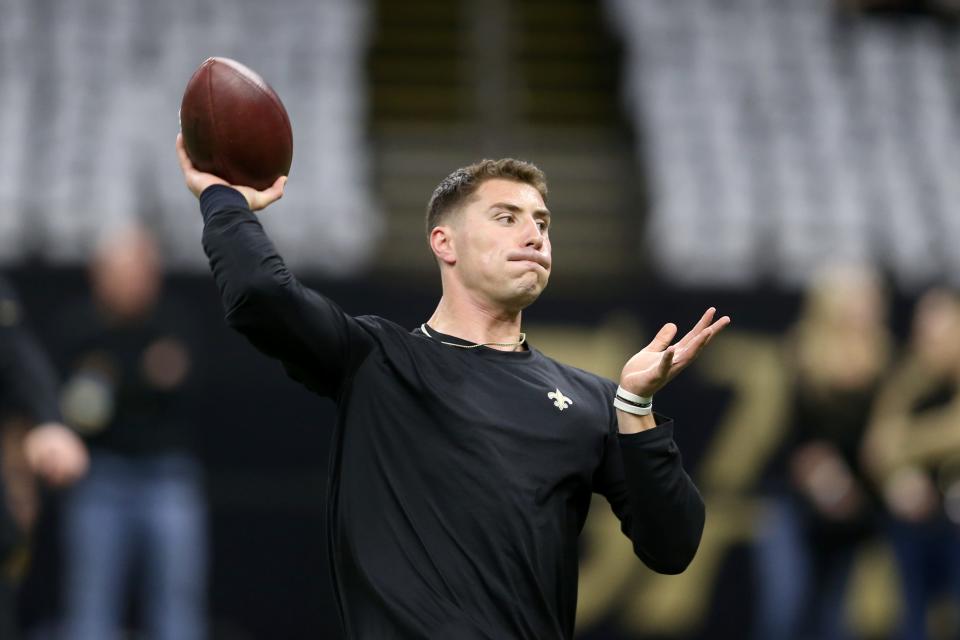 New Orleans Saints quarterback Ian Book warms up before their game against the Atlanta Falcons at the Caesars Superdome.