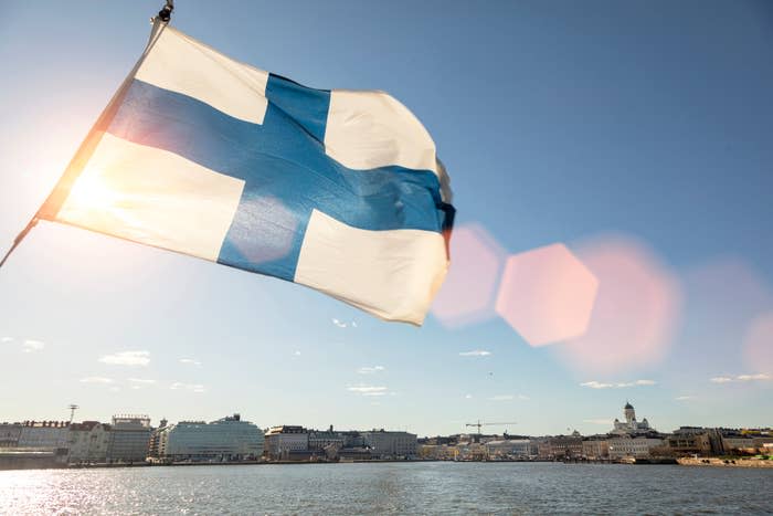 A view of Helsinki from a ferry with a finland flag visible
