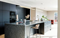 <p> Dark shades and natural stone create a grown up kitchen with a luxe feel. The sheen of polished stone tends to reflect light so there will still be a natural play of light across the surface.  </p> <p> It looks smart by day and recedes by night, only coming to prominence when you choose to light it. </p>