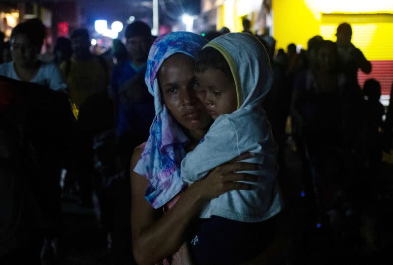 Migrants join a caravan heading to Mexico City, in Huixtla