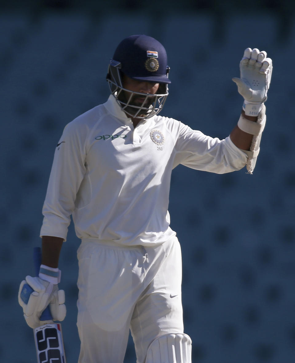 India's M. Vijay celebrates making 100 runs during their tour cricket match against Cricket Australia XI in Sydney, Saturday, Dec. 1, 2018. (AP Photo/Rick Rycroft)