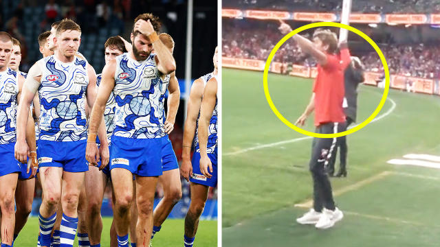 Kangaroos players devastated and Swans star Dane Rampe pointing to the officials.