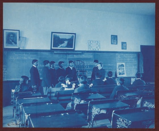 Six boys and a teacher at the Indian Industrial School, Carlisle, Pa.<span class="copyright">Heritage Art/Heritage Images/Getty Images</span>