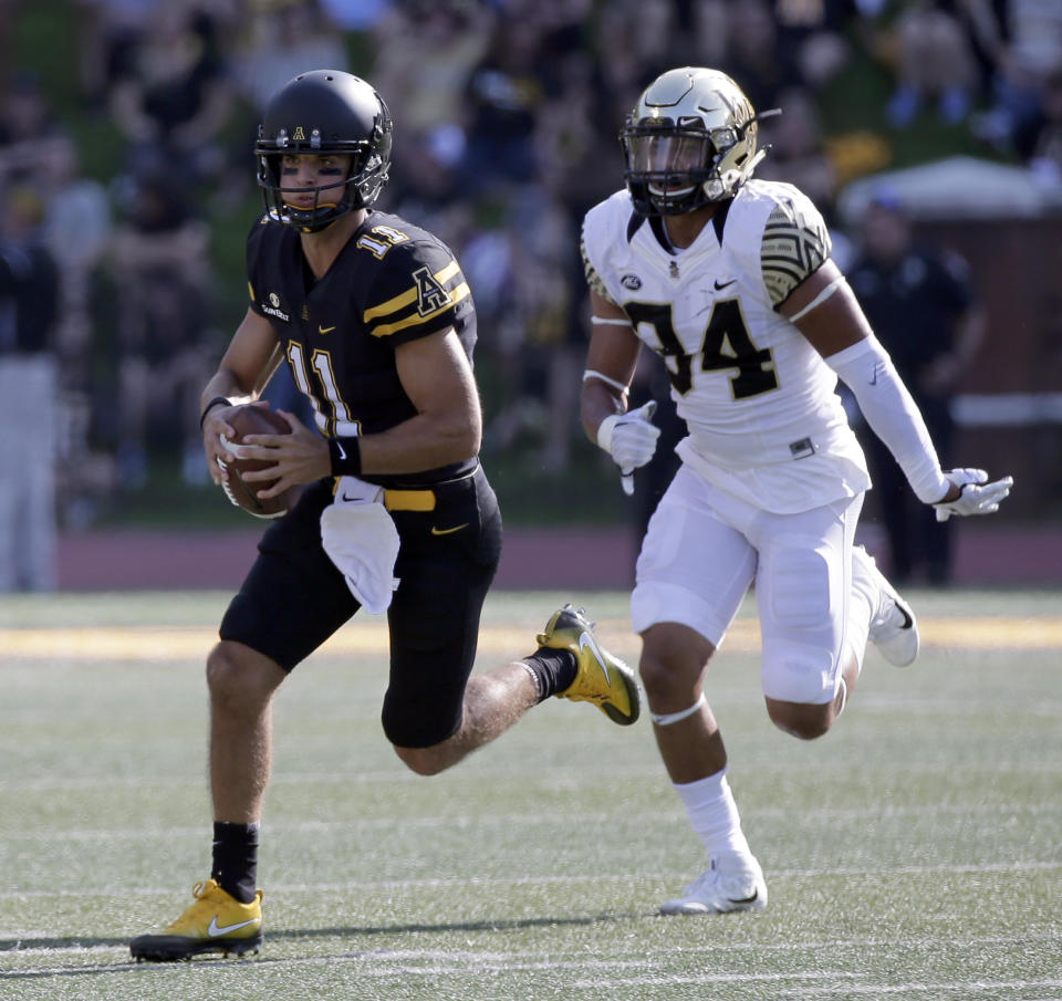 Appalachian State quarterback Taylor Lamb (11) is one of five FBS quarterbacks with at least 25 touchdown passes and six or fewer interceptions. (AP Photo/Chuck Burton)