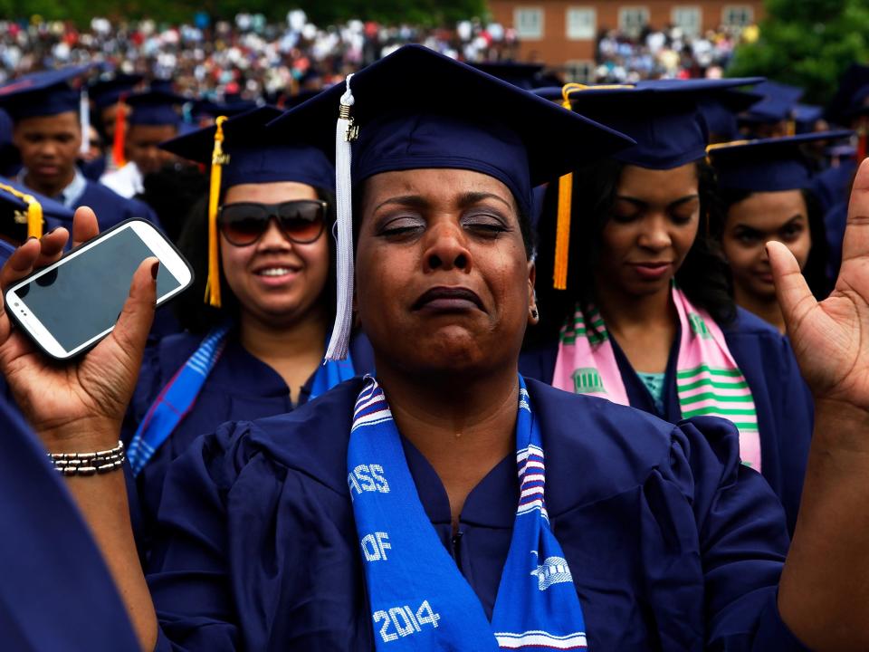 student woman graduation crying praying