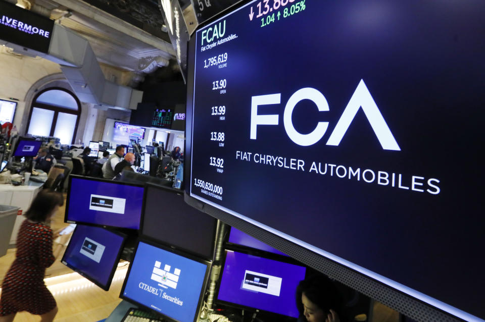 FILE - In this May 28, 2019, file photo, the Fiat Chrysler Automobiles logo appears above a post on the floor of the New York Stock Exchange. Japanese automaker Nissan wasn’t consulted about a proposed merger between its French alliance partner Renault and Fiat Chrysler and has little say over the issue. Partnering with a colossal Renault-Fiat Chrysler could help Nissan slash costs on shared components and research. (AP Photo/Richard Drew, File)