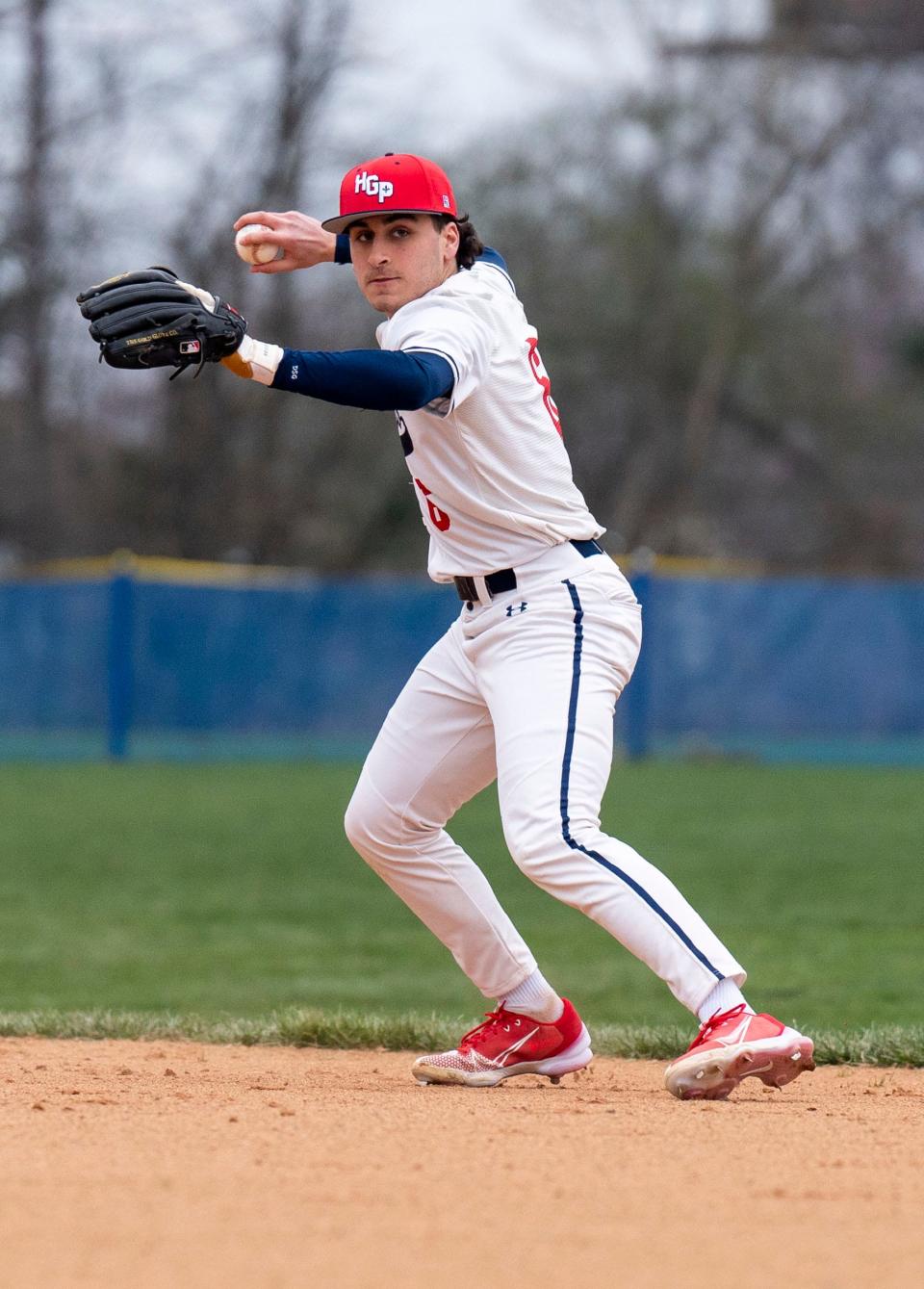 Holy Ghost Prep's Matthew Baker (6) throws the baseball to first base against Archbishop Wood.