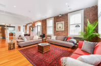 A taste of New York City in the centre of Melbourne, this family-sized sprawling loft apartment oozes charm with its exposed brick walls, polished floor boards, high ceilings and warehouse features.