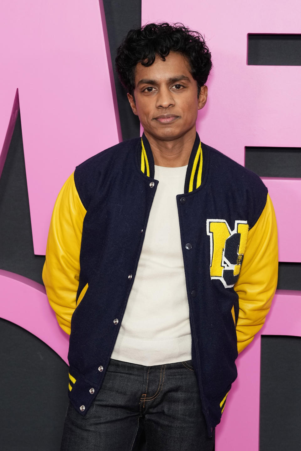 he's wearing the school letterman at the movie premiere