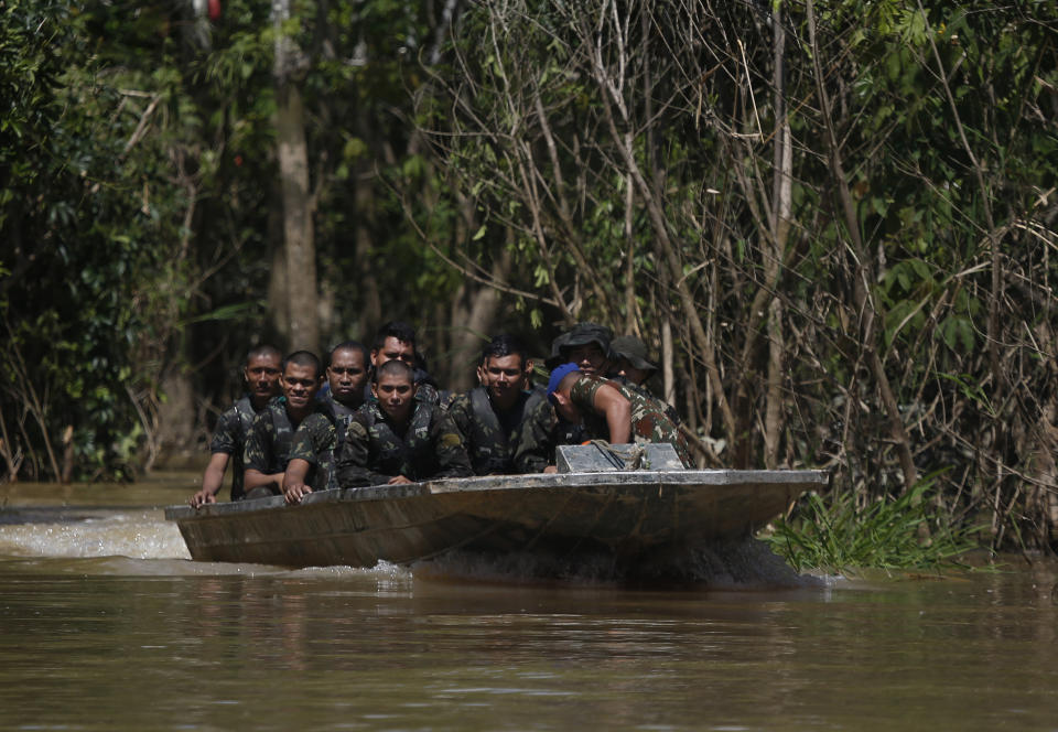 Army soldiers navigate a river during the search for Indigenous expert Bruno Pereira and freelance British journalist Dom Phillips in Atalaia do Norte, Amazonas state, Brazil, Tuesday, June 14, 2022. The search for Pereira and Phillips, who disappeared in a remote area of Brazil's Amazon continues following the discovery of a backpack, laptop and other personal belongings submerged in a river. (AP Photo/Edmar Barros)