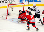 NEWARK, NJ - JUNE 02: Martin Brodeur #30 of the New Jersey Devils allows the game winning goal in overtime from Jeff Carter #77 of the Los Angeles Kings (not pictured) as Dustin Penner #25 celebrates and Stephen Gionta #11 looks on during Game Two of the 2012 NHL Stanley Cup Final at the Prudential Center on June 2, 2012 in Newark, New Jersey. (Photo by Paul Bereswill/Getty Images)