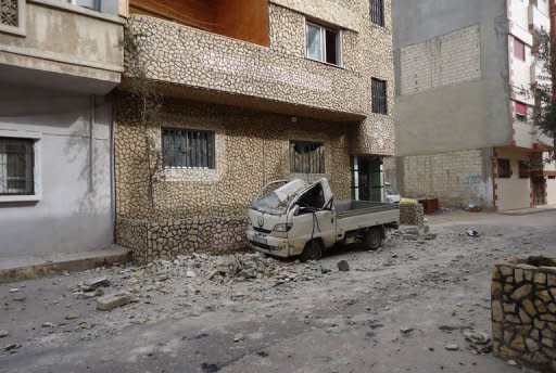 A picture released by a Syrian opposition activist and taken on February 16, 2012 claims to show a vehicle in a bombed street in the Bab Amr neighbourhood of the flashpoint city of Homs. Syrian forces on Friday carried out their heaviest pounding of the city, according to Syrian opposition activists. AFP IS NOT AUTHORISED TO COVER THIS EVENT - THE DATE AND LOCATION CANNOT BE INDEPENDENTLY VERIFIED