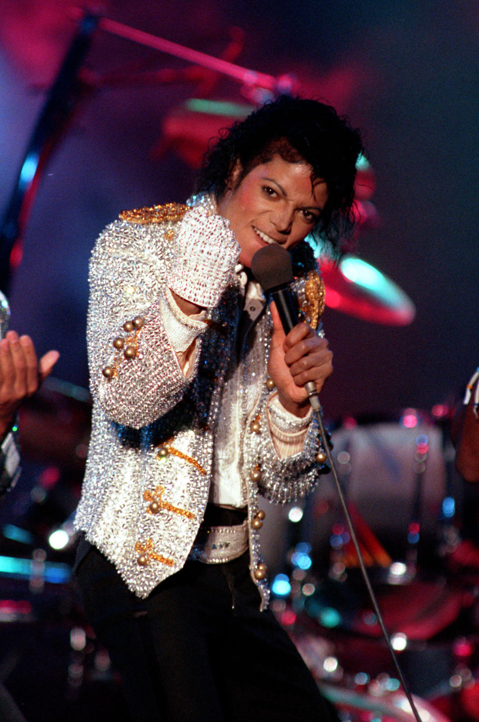 FILE - In this Dec. 3, 1984 photo, Michael Jackson performs with his brothers at Dodger Stadium in Los Angeles, as part of their Victory Tour concert. Jackson's earning potential may become an issue when a Los Angeles jury begins deliberating a negligent hiring lawsuit filed by the singer's mother, Katherine Jackson, against concert giant AEG Live LLC over her son's 2009 death. Witnesses have testified throughout the 21-week trial that the pop superstar was planning a new career in movies after completing his "This Is It" tour that was scheduled to begin in July 2009. (AP Photo/Doug Pizac, file)