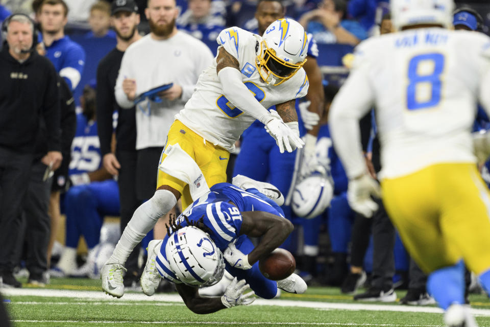 Los Angeles Chargers safety Derwin James Jr. (3) gets ejected after a hit on Indianapolis Colts wide receiver Ashton Dulin (16) during an NFL football game, Monday, Dec. 26, 2022, in Indianapolis. (AP Photo/Zach Bolinger)