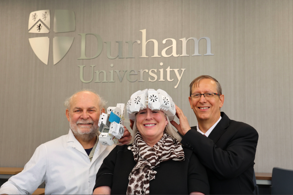 Lead researcher Dr Paul Chazot (left), pictured with GP Dr Gordon Dougal, who devised the helmet and Tracy Sloan who used it to improve her memory (Durham University/PA)