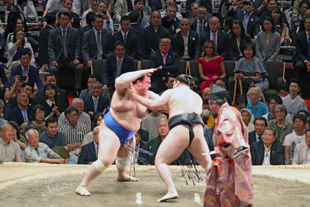 U.S. President Donald Trump, first lady Melania Trump, Japanese Prime Minister Shinzo Abe and wife Akie Abe watch the Summer Grand Sumo Tournament at Ryogoku Kokigikan Sumo Hall in Tokyo, Japan May 26, 2019. REUTERS/Jonathan Ernst